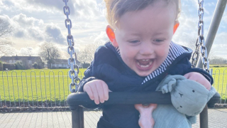 Arlo on the swings